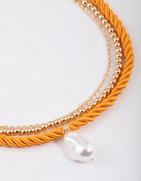 Gold Layered Orange Coloured Rope Pearl Necklace - link has visual effect only