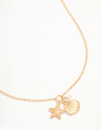 Gold Clam Shell & Starfish Necklace - link has visual effect only